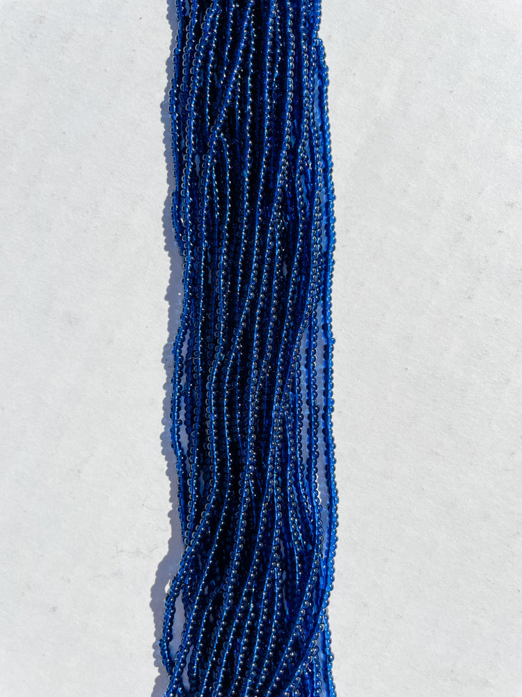 11/0 TRANSP. DK MONTANA BLUE SEED BEADS