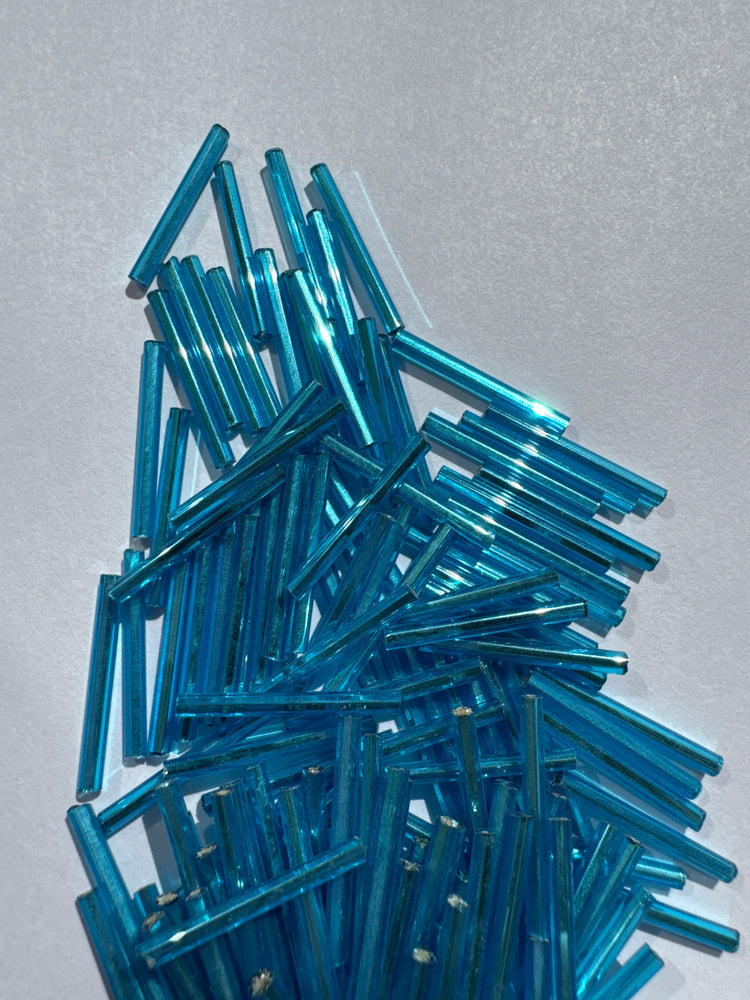 BLUE ZIRCON TANSPARENT SILVER LINED - 20MM BUGLE BEADS