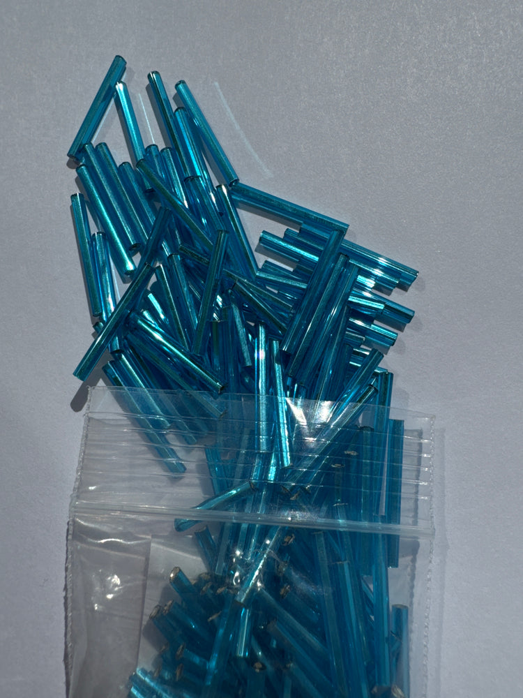 BLUE ZIRCON TANSPARENT SILVER LINED - 20MM BUGLE BEADS