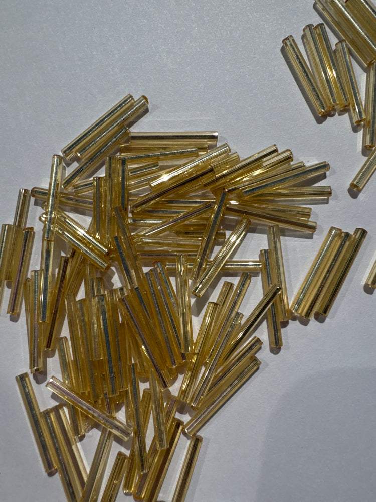 STRAW GOLD TRANSPARENT SILVER LINED - 20MM BUGLE BEADS