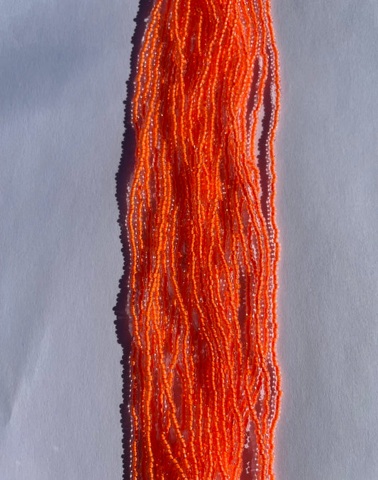 11/0 UV Crystal/Neon Orange UV-Lined Seed Beads