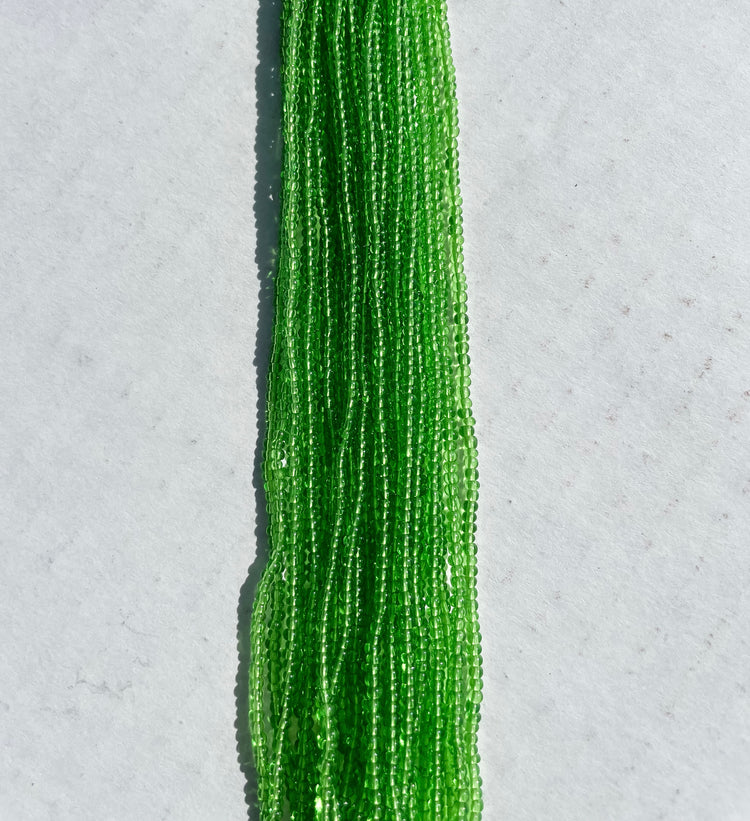 11/0 TRANSP. GREEN SEED BEADS