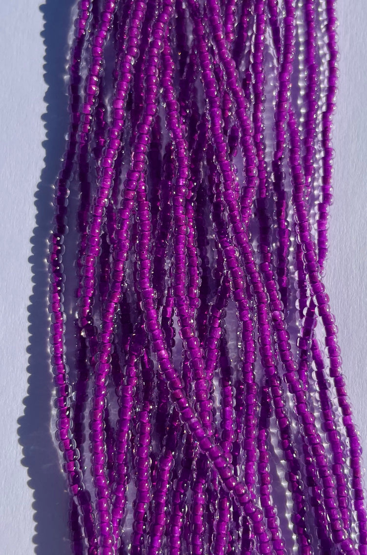 11/0 UV Crystal/Neon Plum UV-lined Seed Beads