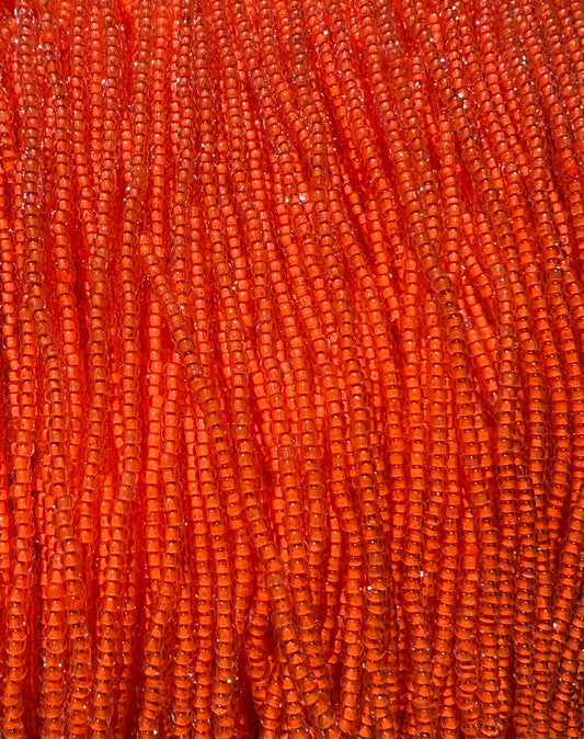 11/0 NEON LINED ORANGE / UV REACTIVE SEED BEADS