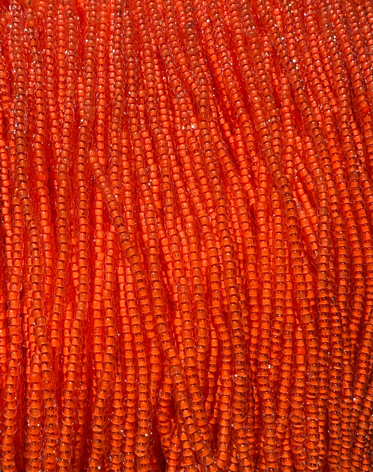 11/0 NEON LINED ORANGE / UV REACTIVE SEED BEADS